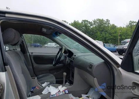 2001 Toyota Corolla Le z USA, uszkodzony, nr VIN 2T1BR12E61C514701